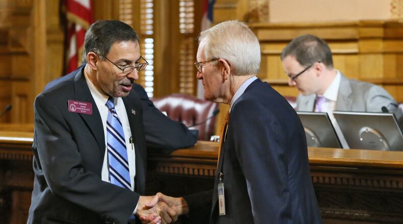 Rep. Mike Cheokas (left), R - Americus, Vice-Chairman of the Higher Education Subcommittee, speaks with Tom Daniel, Sr. Vice Chancellor, External Affairs with the University System of Georgia, who is retiring after more than 40 years with state government. BOB ANDRES / BANDRES@AJC.COM
