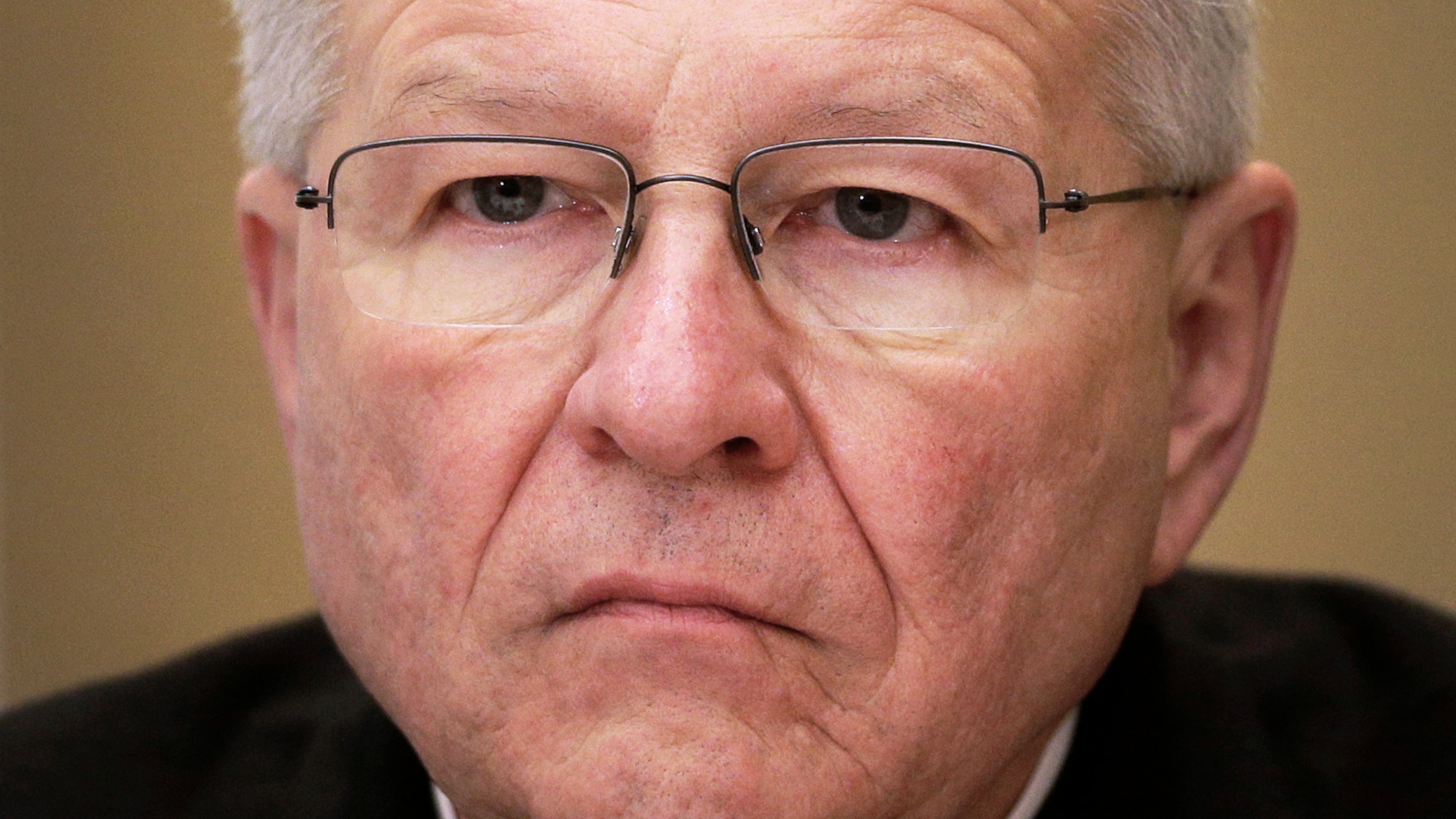 FILE - Archbishop Gregory Aymond, of New Orleans, listens during a news conference at the United States Conference of Catholic Bishops' annual fall meeting in Baltimore, Nov. 12, 2013. (AP Photo/Patrick Semansky, File)