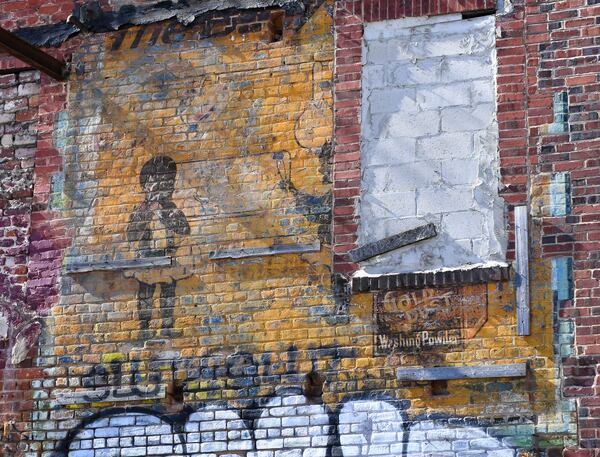 “Gold Dust Baby” mural seen on a historic building on the corner of Jesse Hill Jr. Drive and Auburn Avenue Monday, Nov. 8, 2021. (Daniel Varnado/ For the Atlanta Journal-Constitution)