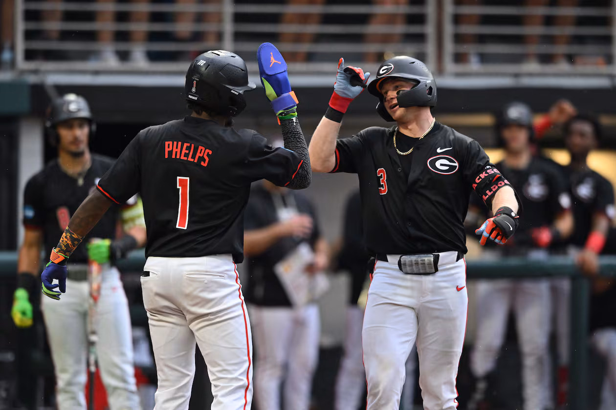 Georgia catcher Daniel Jackson (3) celebrates with Georgia infielder Tre Phelps (1) after hitting a solo home run during the fifth inning of their NCAA Regional game at Foley Field, Friday, May 29, 2026, in Athens. (Hyosub Shin/AJC)