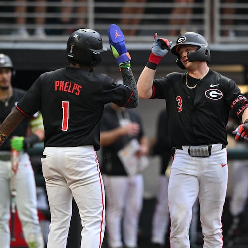 Georgia catcher Daniel Jackson (right) celebrates with Georgia infielder Tre Phelps (left) after hitting a solo home run during the fifth inning of their NCAA Regional game at Foley Field, Friday, May 29, 2026, in Athens. (Hyosub Shin/AJC)