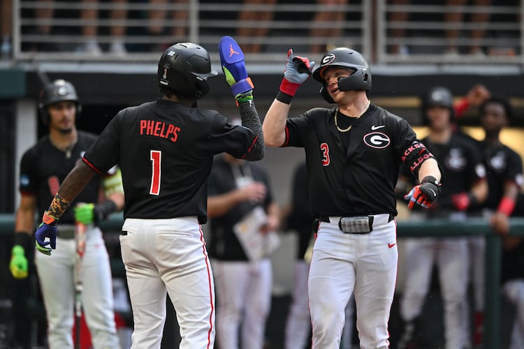 Georgia catcher Daniel Jackson (3) celebrates with Georgia infielder Tre Phelps (1) after hitting a solo home run during the fifth inning of their NCAA Regional game at Foley Field, Friday, May 29, 2026, in Athens. (Hyosub Shin/AJC)