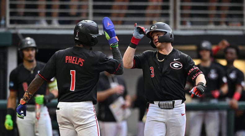 Georgia catcher Daniel Jackson (right) celebrates with Georgia infielder Tre Phelps (left) after hitting a solo home run during the fifth inning of their NCAA Regional game at Foley Field, Friday, May 29, 2026, in Athens. (Hyosub Shin/AJC)