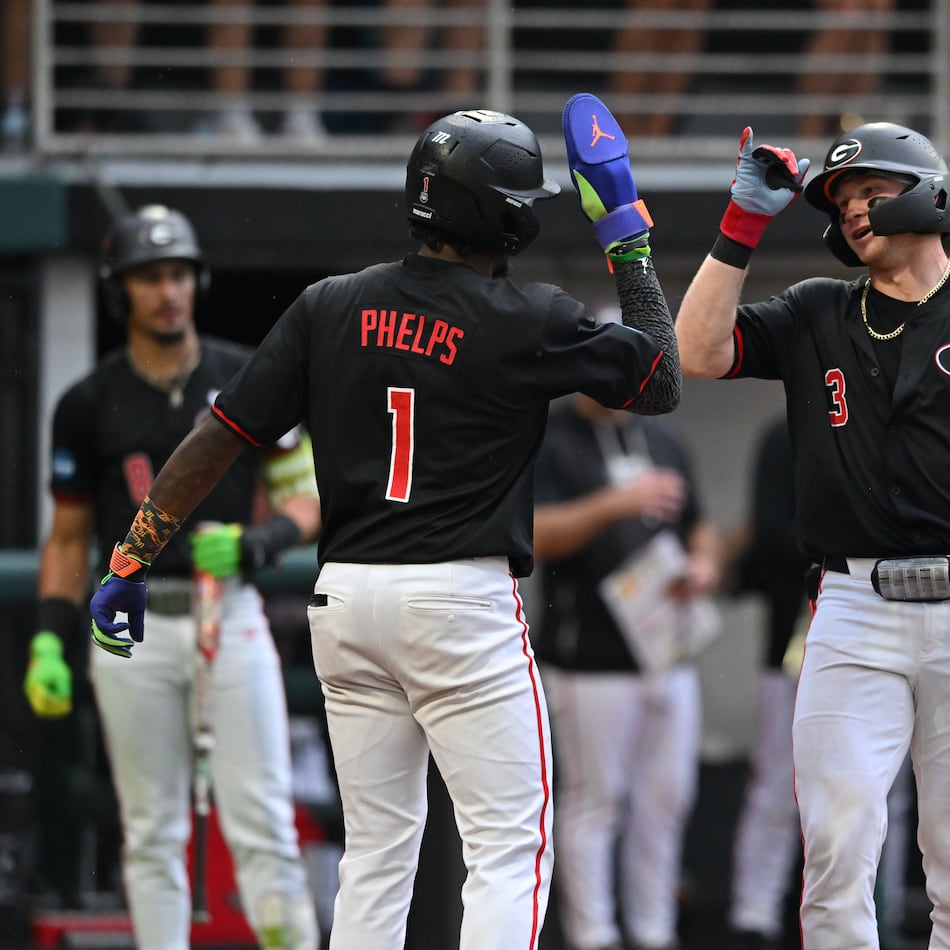 Georgia catcher Daniel Jackson (3) celebrates with Georgia infielder Tre Phelps (1) after hitting a solo home run during the fifth inning of their NCAA Regional game at Foley Field, Friday, May 29, 2026, in Athens. (Hyosub Shin/AJC)
