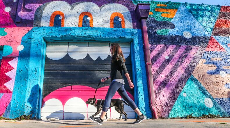 A woman enjoyed spring-like weather in metro Atlanta on Wednesday. JOHN SPINK / JSPINK@AJC.COM