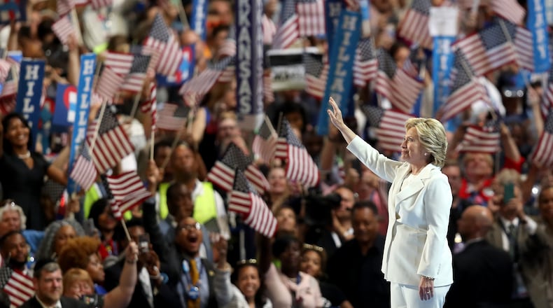 PHILADELPHIA, PA - JULY 28: Democratic presidential candidate Hillary Clinton acknowledges the crowd as she arrives on stage during the fourth day of the Democratic National Convention at the Wells Fargo Center, July 28, 2016 in Philadelphia, Pennsylvania. Democratic presidential candidate Hillary Clinton received the number of votes needed to secure the party's nomination. An estimated 50,000 people are expected in Philadelphia, including hundreds of protesters and members of the media. The four-day Democratic National Convention kicked off July 25. (Photo by Joe Raedle/Getty Images)