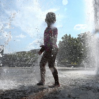 Paulina Lopez, 4, plays in the Big Splash fountain at Town Center Park on Wednesday, Sept. 2, 2026, in Suwanee. The National Weather Service predicts hot and humid conditions for the long Labor Day weekend. (Hyosub Shin/AJC)