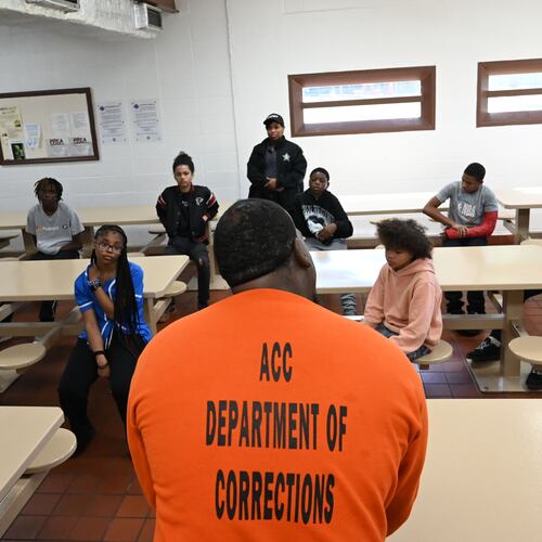 Marcus Lawson (foreground, center), an inmate at the Athens-Clarke County Correctional Institution, speaks to students inside the prison Saturday, May 16, 2026, in Athens. "Don't do to your mama what I did to mine," said Lawson, who was sentenced to 30 years for numerous offenses related to the robbery of taxicab drivers. (Hyosub Shin/AJC)