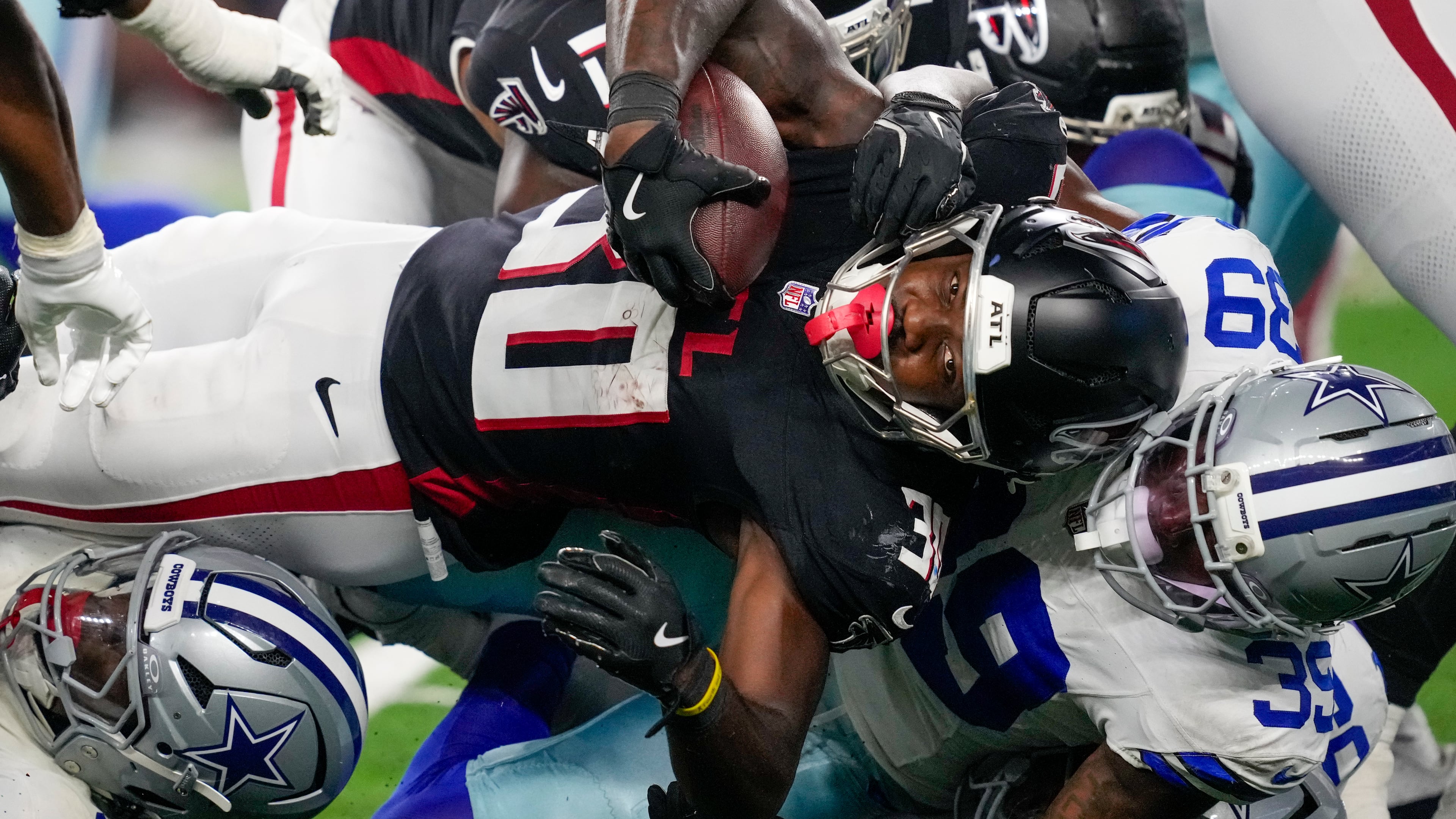 Falcons running back Jashaun Corbin is tackled by Cowboys safety Mike Smith Jr. during a preseason NFL football game on Friday, Aug. 22, 2025, in Arlington, Texas. Corbin had a bad drop early, but rushed 11 times for 51 yards. (Tony Gutierrez/AP)