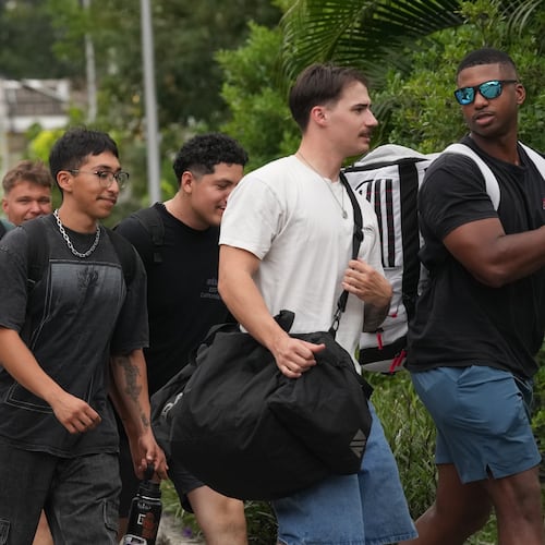American service members from the USS Abraham Lincoln strike group arrive at a hotel in Pattaya, Thailand, Wednesday, Sept. 2, 2026. (AP Photo/Sakchai Lalit)