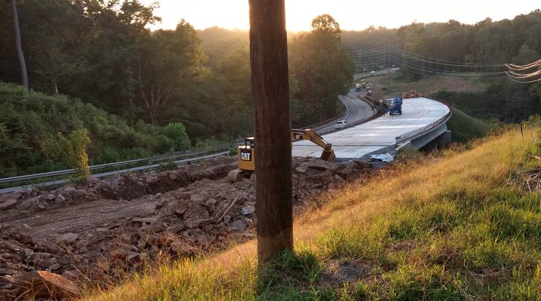 Georgia DOT crews are building a replacement bridge on Arnold Mill Road at the Fulton-Cherokee County line. Arnold Mill Road / Ga. 140 will be moved just to the north to connect to the new bridge high above Little River. Photo taken Aug. 5, 2018. (Brian O'Shea / bposhea@ajc.com)