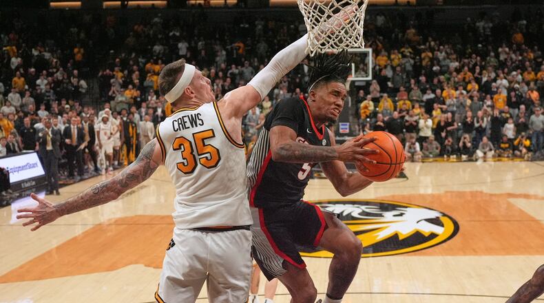 Georgia’s Jeremiah Wilkinson (right) heads to the basket as Missouri’s Jacob Crews defends on Tuesday, Jan. 20, 2026, in Columbia, Mo. The No. 21-ranked Bulldogs pulled out a 74-72 win at Mizzou Arena. (Jeff Roberson/AP)
