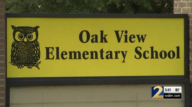 Two young girls allegedly had their hands tied behind their backs by two teachers at Oak View Elementary School.