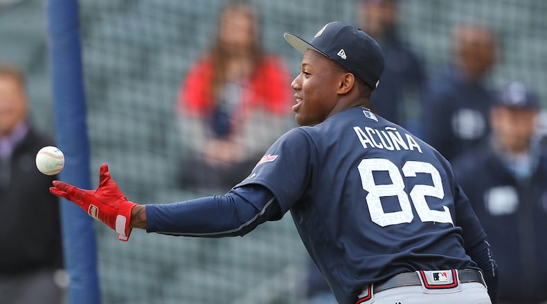 Ronald Acuna preparing for Tuesday night’s exhibition game between Braves prospects and the major league team at SunTrust Park. (Curtis Compton/ccompton@ajc.com)