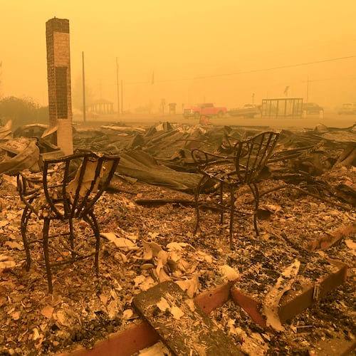 FILE - Chairs stand at a post office in the aftermath of the Santiam Fire in Gates, Ore., Sept 9, 2020. (Mark Ylen/Albany Democrat-Herald via AP, File)