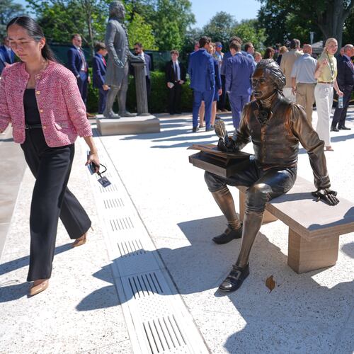 FILE - A bronze depiction of Thomas Jefferson seated and signing the Declaration of Independence is seen before President Donald Trump speaks during an event to honor the 2025 World Series champions Los Angeles Dodgers in the Rose Garden of the White House, July 23, 2026, in Washington. (AP Photo/Julia Demaree Nikhinson, File)