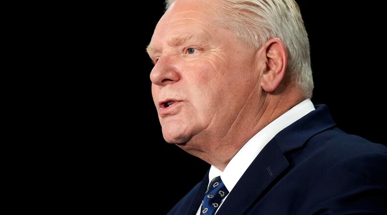 FILE - Ontario Premier Doug Ford speaks to the media regarding the federal governments decision to allow Chinese EV's into Canada at Queen's Park in Toronto on Wednesday, Jan. 21, 2026. (Nathan Denette/The Canadian Press via AP, File)