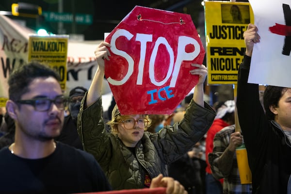 Protestors march against Immigration and Customs Enforcement in Atlanta on Thursday, Jan. 8, 2026, the day after Renee Good was shot and killed by an ICE agent in Minneapolis. (Arvin Temkar/AJC)
