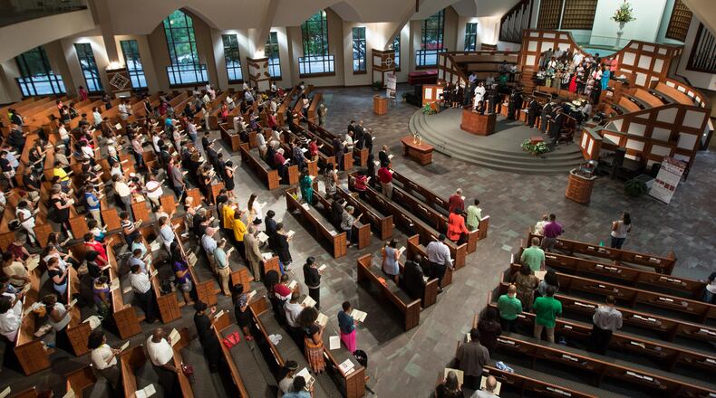 EBENEZER VIGIL--People stand during a prayer service at Ebenezer Baptist Church for the nine people who were killed at the historic Emanuel AME Church in Charleston, S.C., Thursday, June 18, 2015, in Atlanta. BRANDEN CAMP/SPECIAL