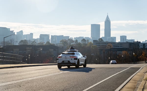 A Waymo self-driving taxi travels down 17th Street in Atlanta, Georgia, Thursday, Dec. 11, 2025. (Ben Hendren for the AJC)