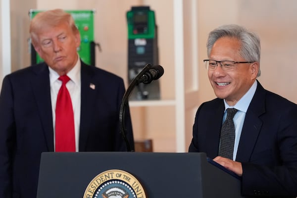 President Donald Trump listens as Nvidia CEO Jensen Huang speaks during an event about investing in America in the Cross Hall of the White House, Wednesday, April 30, 2025, in Washington. (AP Photo/Alex Brandon)
