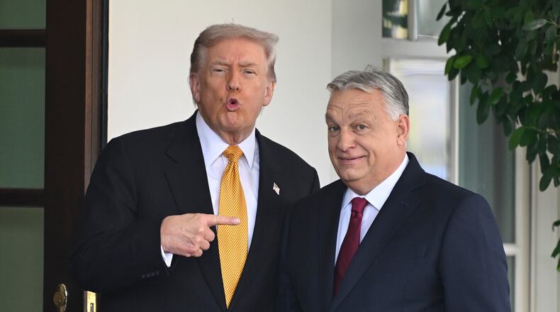 FILE - President Donald Trump, left, greets Hungary's Prime Minister Viktor Orban at the White House, Friday, Nov. 7, 2025, in Washington. (AP Photo/John McDonnell,File)