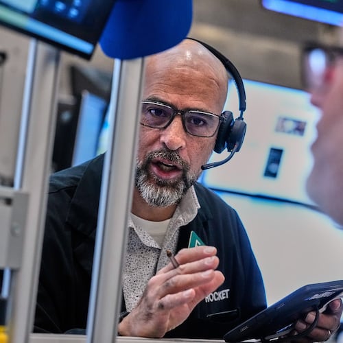 Options traders Steven Rodriguez, left, and Marty Handler work on the floor of the New York Stock Exchange, Wednesday, June 3, 2026. (AP Photo/Richard Drew)