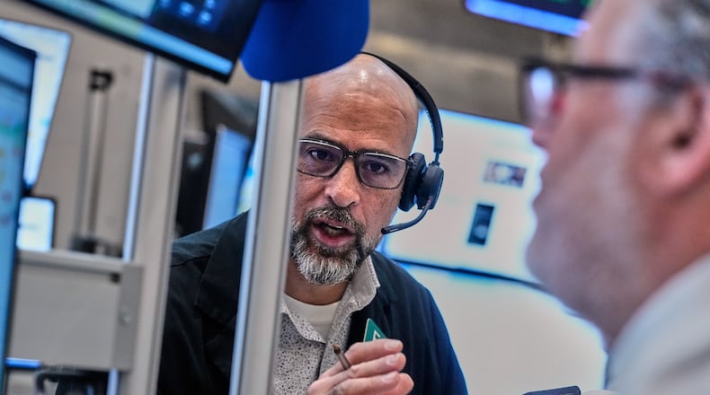 Options traders Steven Rodriguez, left, and Marty Handler work on the floor of the New York Stock Exchange, Wednesday, June 3, 2026. (AP Photo/Richard Drew)