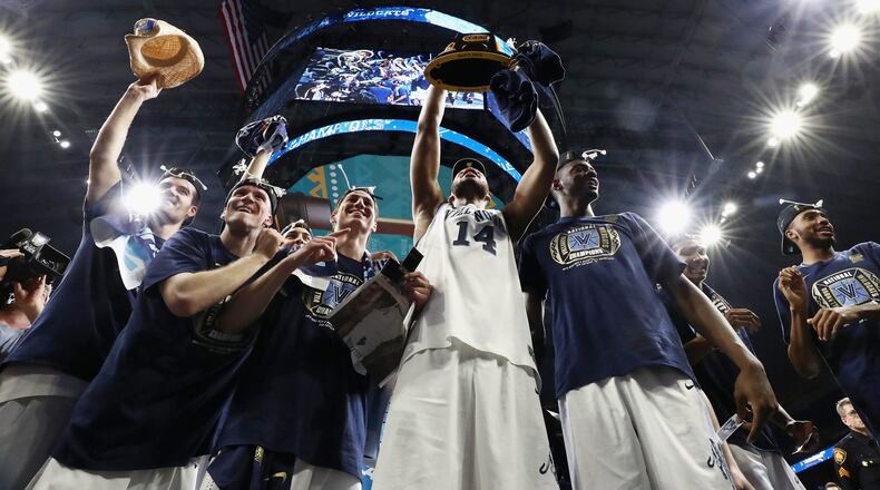 The Villanova Wildcats celebrate after defeating Michigan for the national championship Monday night in San Antonio.