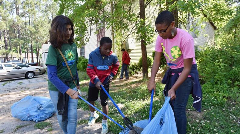 DeKalb County residents are encouraged to help clean up the Scottdale community Saturday morning. AJC file photo
