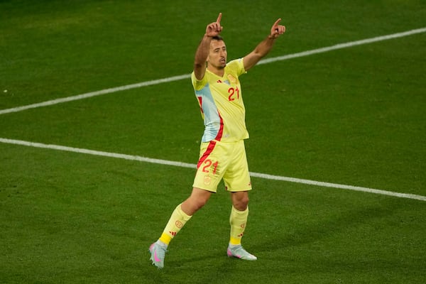 Spain's Mikel Oyarzabal celebrates scoring his side's second goal against Portugal during the Nations League final soccer match between Portugal and Spain at the Allianz Arena in Munich, Germany, Sunday, June 8, 2025. (AP Photo/Michael Probst)
