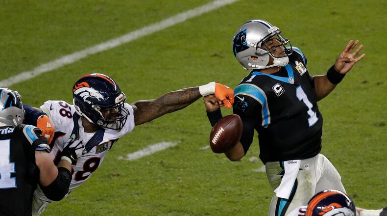 Denver Broncos Von Miller (58) strips the ball from Carolina Panthers Cam Newton (1) during the second half of the NFL Super Bowl 50 football game Sunday, Feb. 7, 2016, in Santa Clara, Calif. (AP Photo/Charlie Riedel)