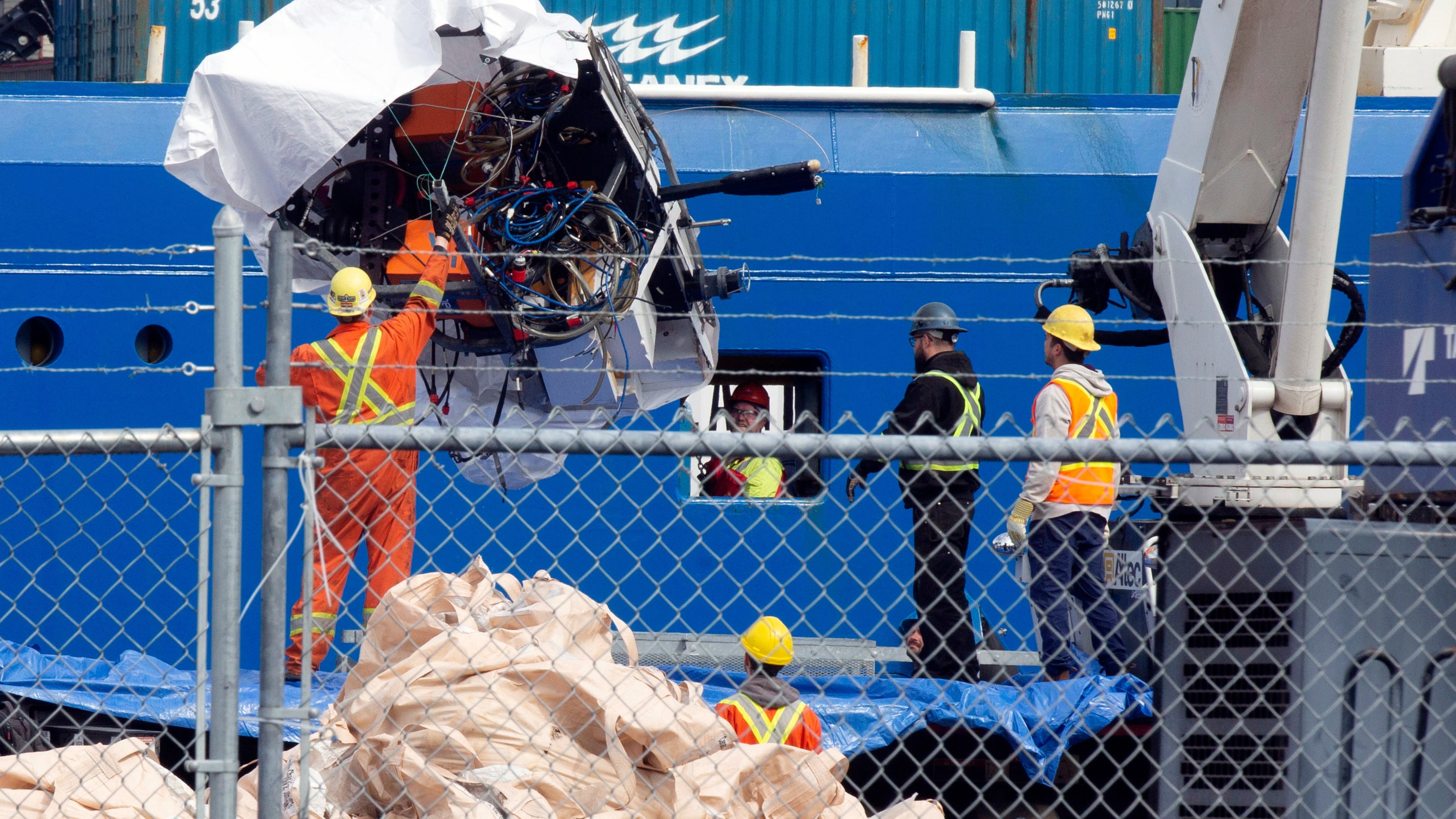 FILE - Debris from the Titan submersible, recovered from the ocean floor near the wreck of the Titanic, is unloaded from the ship Horizon Arctic at the Canadian Coast Guard pier in St. John's, Newfoundland, June 28, 2023. (Paul Daly/The Canadian Press via AP, File)