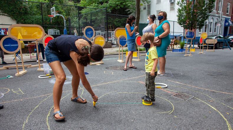 People play on a closed street in New York City that's part of the Play Streets project to safely provide physical activities to children. Contributed by Street Lab.