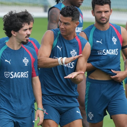 Portugal's Cristiano Ronaldo, center talks to Vitinha during the men's national soccer team World Cup training session Thursday, June 25, 2026, in Palm Beach Gardens, Fla. (AP Photo/Marta Lavandier)