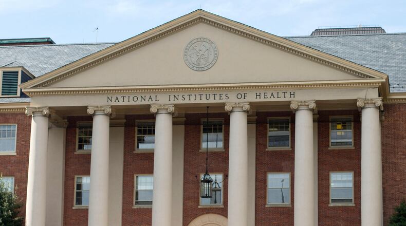 FILE - The National Institutes of Health's James Shannon building is seen on the agency's campus in Bethesda, Md., Oct. 24, 2014. (AP Photo/Pablo Martinez Monsivais, File)