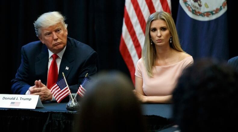 Republican presidential candidate Donald Trump, left, and his daughter Ivanka meet with spouses of military service members, Tuesday, Sept. 6, 2016, in Virginia Beach, Va. (AP Photo/Evan Vucci)
