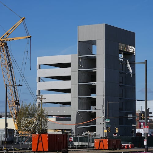 First responders inspect a partially collapsed parking garage in Philadelphia, Thursday, April 9, 2026. (AP Photo/Matt Rourke)