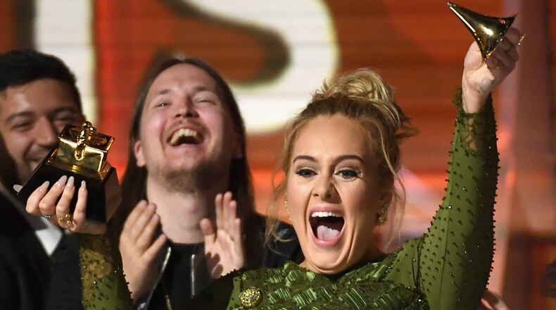 Adele veered from tears to laughter while accepting her album of the year Grammy for "25," moments after winning record of the year for "Hello." (Photo by Kevork Djansezian/Getty Images)