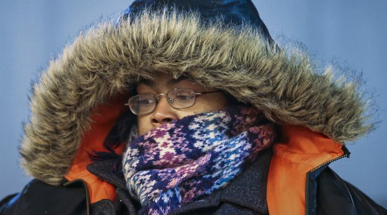 Yoshiaka Norris was bundled for an arctic expedition Friday as she headed into the Five Points MARTA Station.