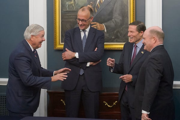 German Chancellor Friedrich Merz, second from left, talks with, from left, Sen. Lindsey Graham, R-S.C., Sen. Richard Blumenthal, D-Conn., and Sen. Chris Coons, D-Del., at the U.S.,Capitol, Thursday, June 5, 2025, in Washington. (AP Photo/Rod Lamkey, Jr.)