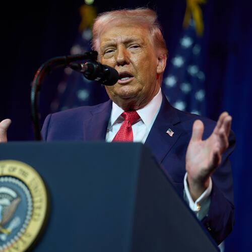 President Donald Trump, seen here addressing House Republican during their annual policy retreat Tuesday, says he’s entitled to compensation under a new Georgia law because the district attorney was thrown off the case, which was subsequently tossed. (Evan Vucci/AP)