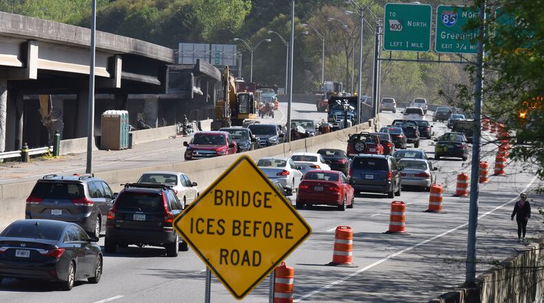 April 1, 2017 Atlanta - Motorists use the Buford-Spring Connector to bypass the interstate collapse and then return to I-85 North on Saturday, April, 2017. After the collapse, people traveling northbound on the Downtown Connector were funneled onto I-75 North, with no option to take I-85 North at the split. About 10 a.m., however, transportation officials began allowing northbound traffic on the Connector to proceed north on I-85 to the next exit: the Buford-Spring Connector, Exit 86 (Ga. 13). HYOSUB SHIN / HSHIN@AJC.COM