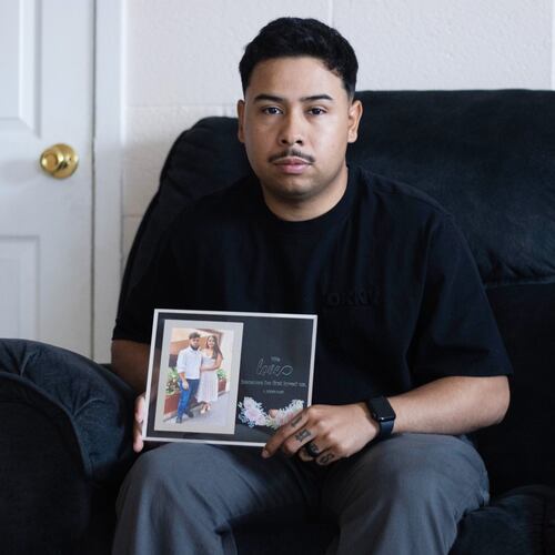 FILE - Army Sgt. Hedar Leonel Turcios Juarez holds a picture of himself with with his wife Cristy at home in El Paso, Texas, July 21, 2026. (AP Photo/Ryan Romero, File)