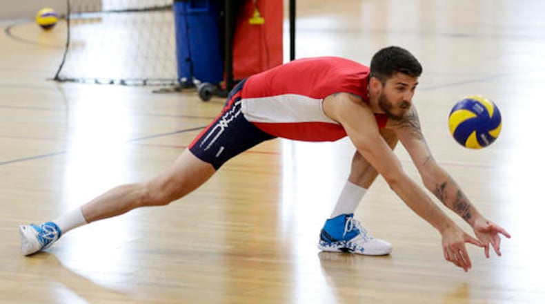 In this May 25, 2016 photo, Olympic volleyball player Matt Anderson, of the United States, lunges for a ball during practice, in Anaheim, Calif. In late 2014, Anderson found himself in a deep funk and made that daunting decision to step away from volleyball to find himself. Eventually, he found his way back, and Anderson will lead the Americans into their Olympic opener Sunday, Aug. 7, against Canada. (AP Photo/Chris Carlson)