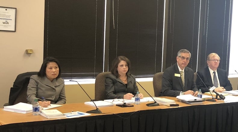 The State Election Board approved a plan Monday to allow Georgia voters to request absentee ballots by going online. From left: State Election Board members Anh Le, Rebecca Sullivan, Secretary of State Brad Raffensperger and David Worley. MARK NIESSE / MARK.NIESSE@AJC.COM