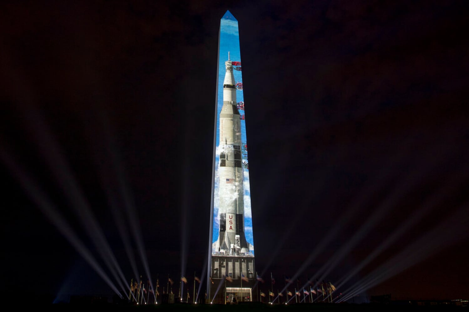 Photos: Apollo 11 Saturn V rocket lights up Washington Monument