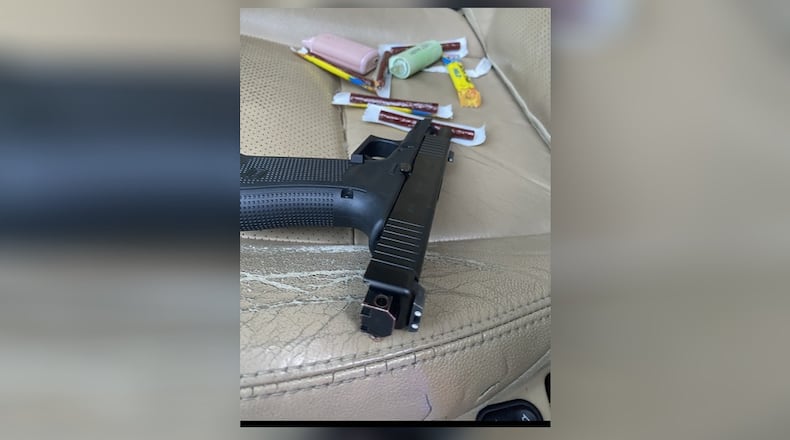 A Griffin murder suspect was found with a Glock handgun when he was arrested Saturday, authorities said.