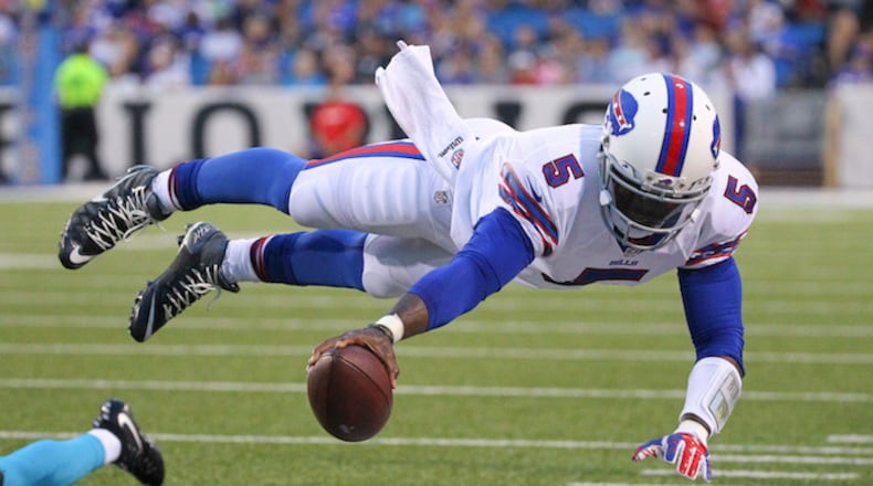 FILE - In this Aug. 15, 2015 file photo, Buffalo Bills quarterback Tyrod Taylor (5) dives for the first down marker during the first half of an NFL preseason football game against the Carolina Panthers in Orchard Park, N.Y. Two people familiar with the trade said Friday, March 9, 2018, the Cleveland Browns have agreed to acquire Taylor from the Bills for a third-round draft pick this year.  (AP Photo/Bill Wippert, File)