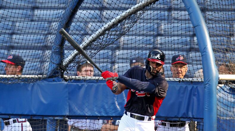 Atlanta Braves outfielder Jason Heyward wears a batting helmet with a protective shield as he hits during batting practice for the first time after getting hit by a pitch before the Braves host the San Diego Padres at Turner Field Friday night in Atlanta, Ga., September 13, 2013. On August 21, 2013, Heyward was struck in the right jaw by a fastball from New York Mets pitcher Jonathon Niese. The injury required a surgery inserting two plates to stabilize the two fractures in his jaw.